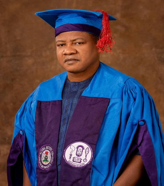 Nelson Alapa in academic attire